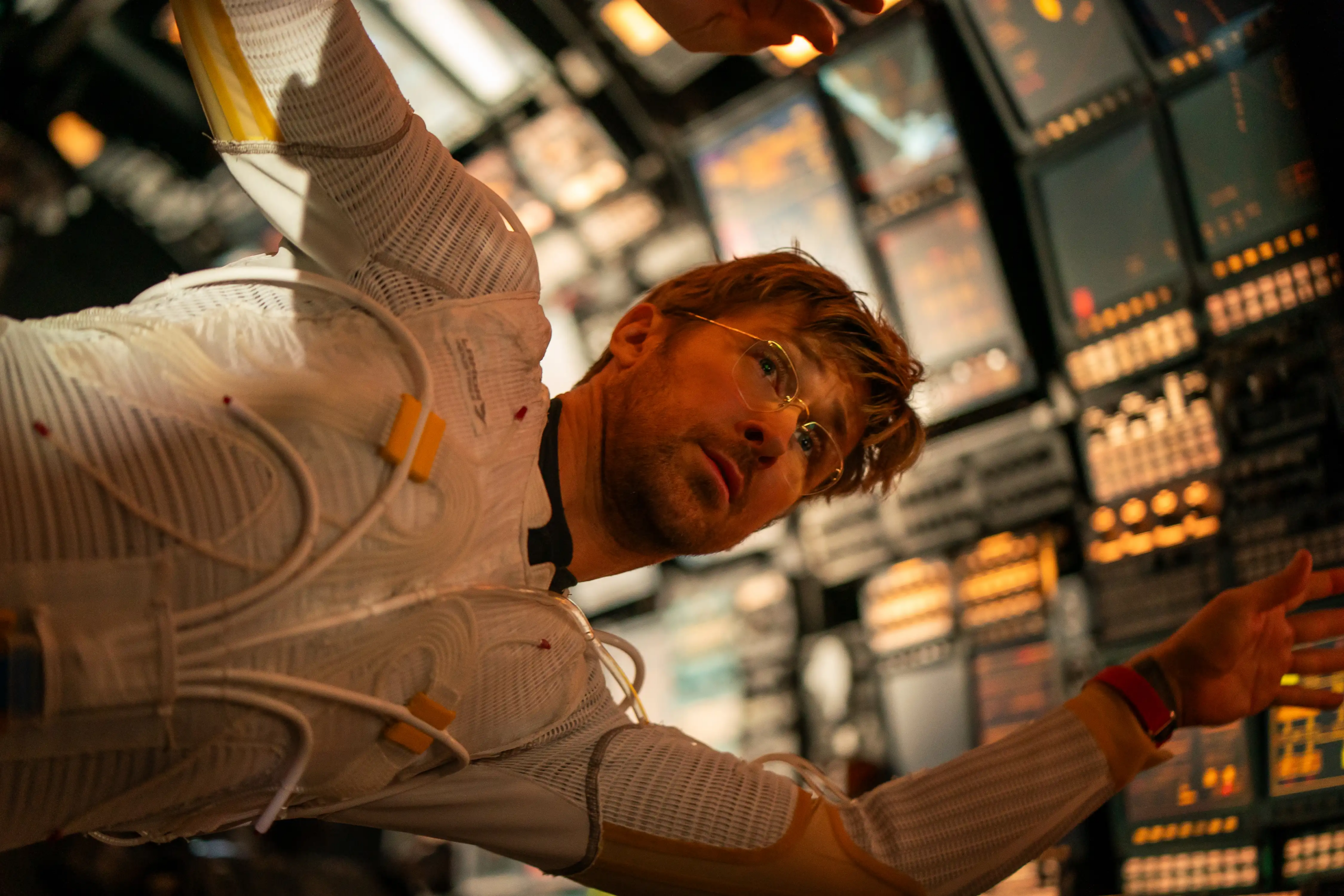 Ryan Gosling floats through his spaceship wearing a temperature-controlled space suit.
